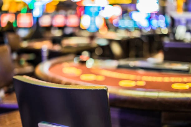 Betting chips stacked in a pot at centre of Sakong table
